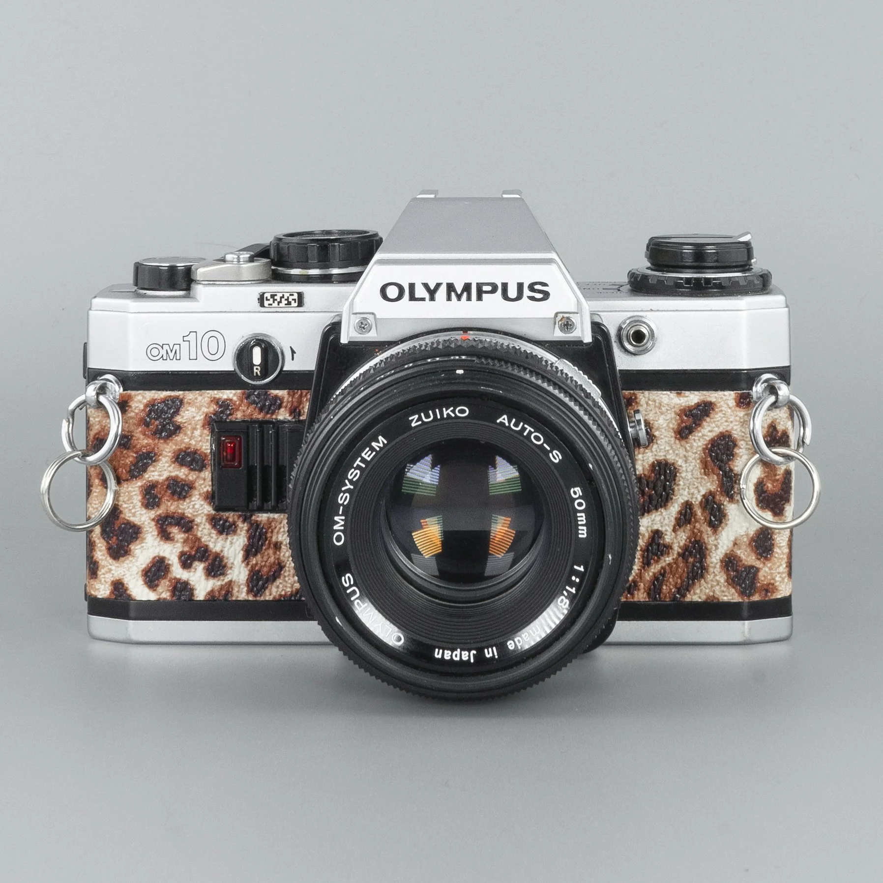 Olympus OM10 (Leopard) - Refurbished 35mm SLR Film Camera — LensFayre